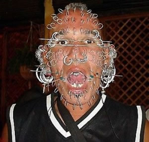 man with many piercings